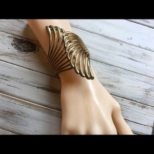 Edgy Gold tone bypass bracelet